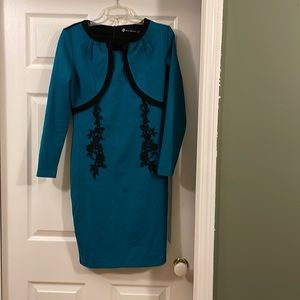 Emerald green and black dress.